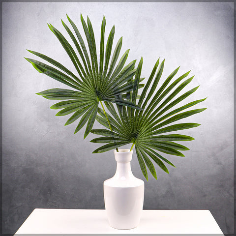 Artificial palm leaves for home decor in tropical styling