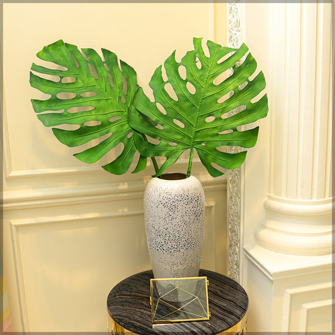 Faux monstera leaf in vase