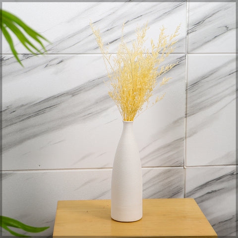 Large white ceramic vase perfect for modern living rooms