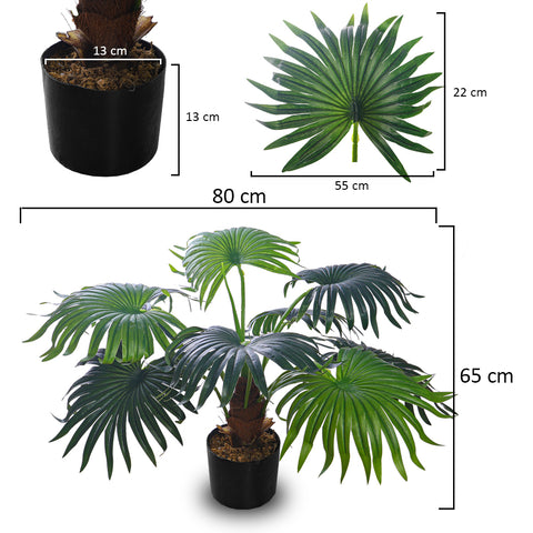 Large artificial palm leaves in a stylish pot for home decor