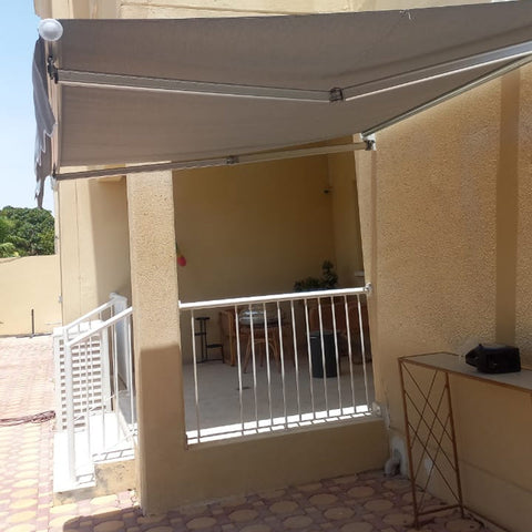 Large retractable balcony awning for sun protection