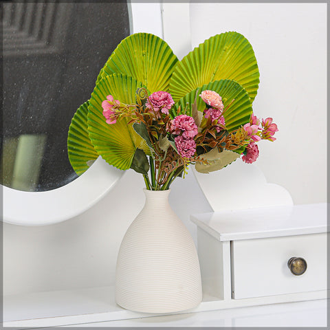 Small artificial palm leaves for indoor styling