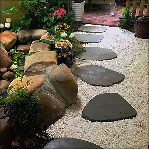 Smooth white pebbles enhancing a decorative garden arrangement