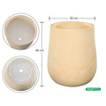 Textured round magnesium oxide plant pot