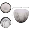 White gray round plastic planter